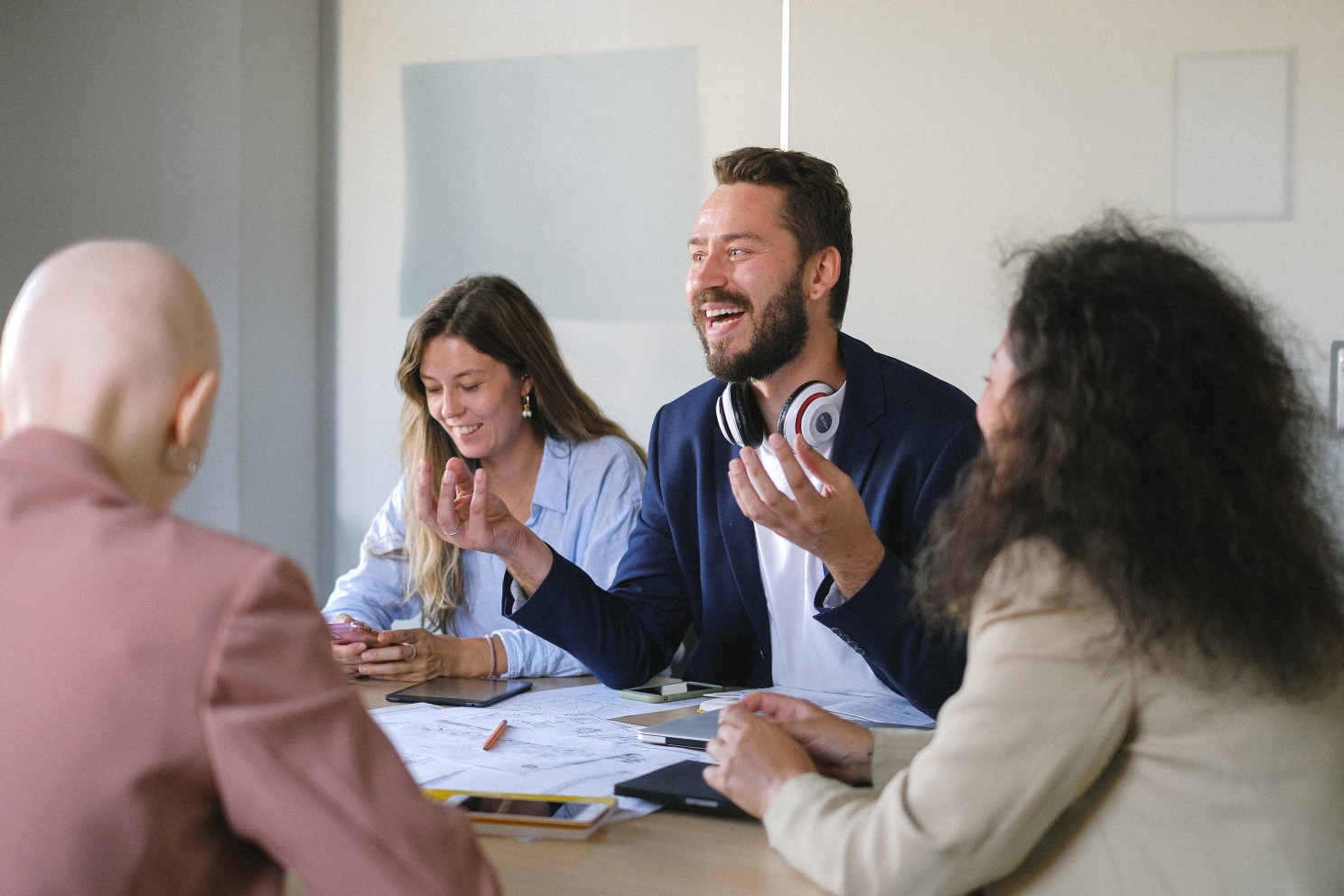 Group of cheerful business people discussing strategy.